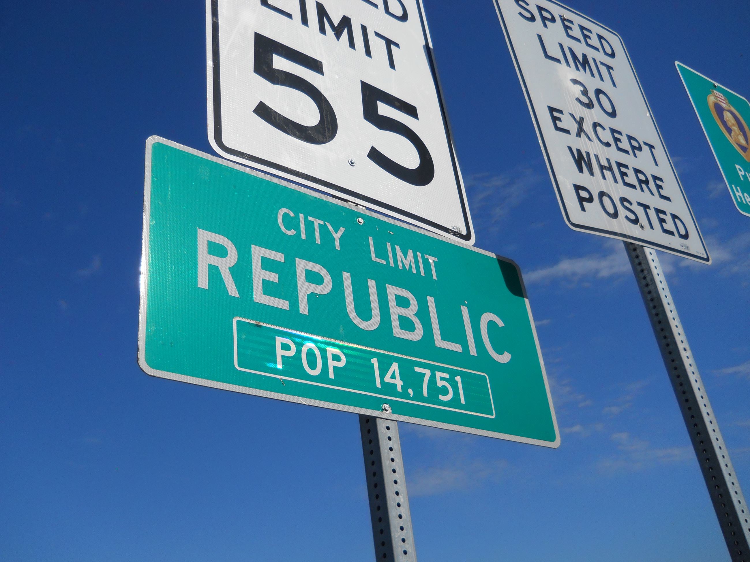 Signs marking the City Limits of Republic.